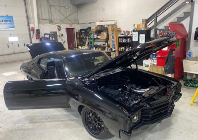 back sportscar with doors, hood and trunk open