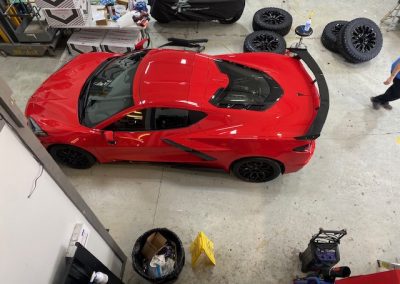 Red sportscar with spoiler and tinted windows view from top