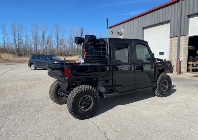 Speakers attached to black UTV