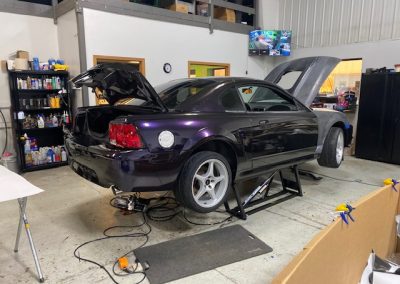 Hood and trunk open on car being worked on